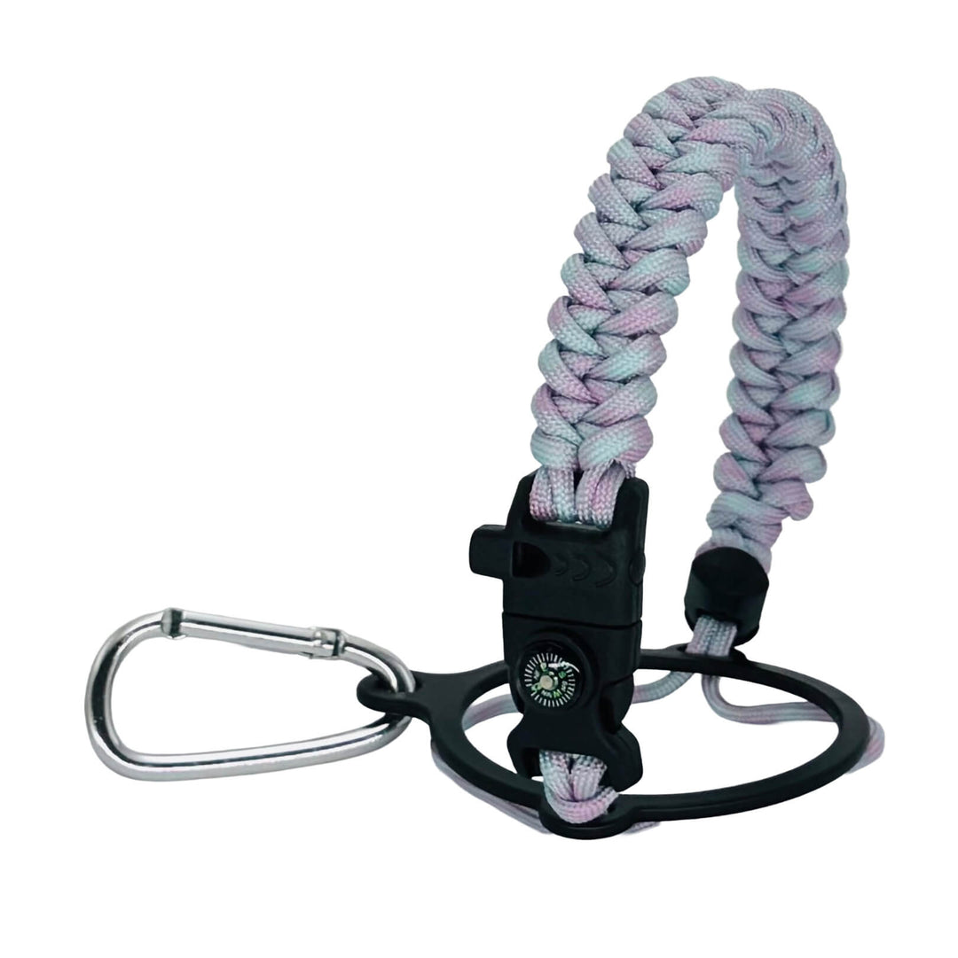 A paracord keychain with a braided strap in pastel pink, purple, and blue, attached to a black plastic buckle and a silver carabiner, shown on a white background.